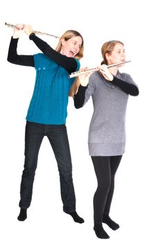Rivalry between two young women with transverse flute isolated on white background.