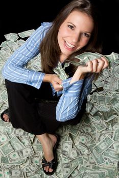 Smiling young woman holding money