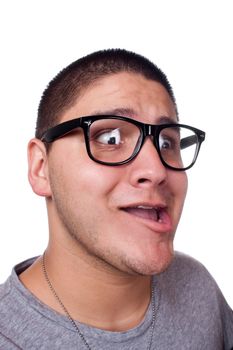 A goofy man wearing trendy nerd glasses isolated over white with a funny expression on his face.