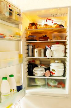 opened refrigerator inside full of various foodstuff
