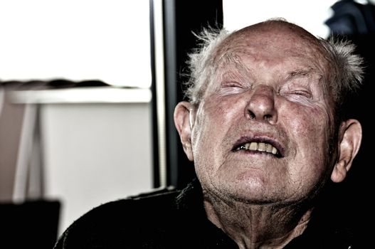 Shot of very old senior man expressing painful