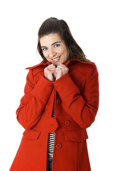 Beautiful fashion woman posing with a red coat isolated on white
