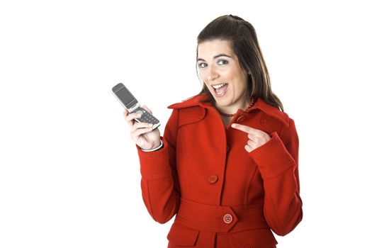 Beautiful happy young woman with a red coat holding a cellphone