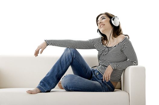 Beautiful happy woman listen music with headphones