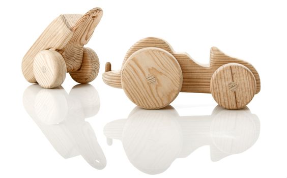 Tractor wooden toy isolated on white with reflection