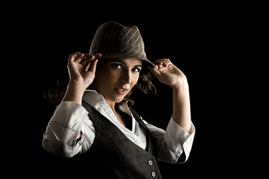 Young woman portrait with hat on a black background

