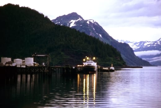 Ship in Orca Inlet with lights on