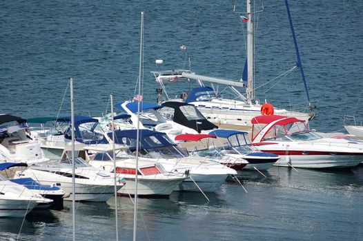 many yachts moored in port