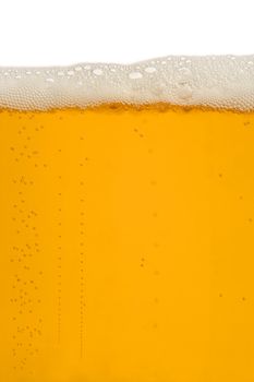 A macro image of a glass of beer.
