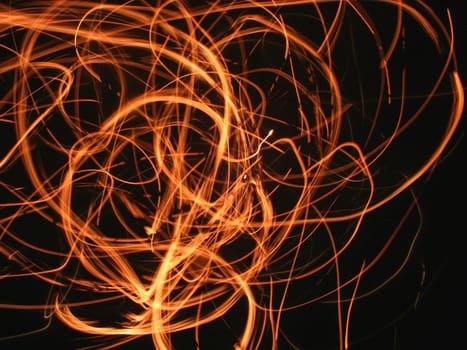A whirl of flame and sparks light up the night.