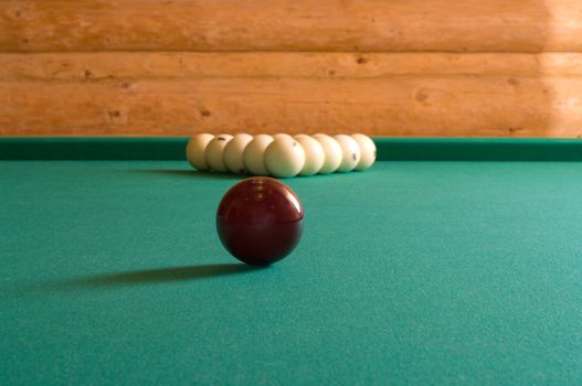 Balls for Russian billiards on a table with green baize.