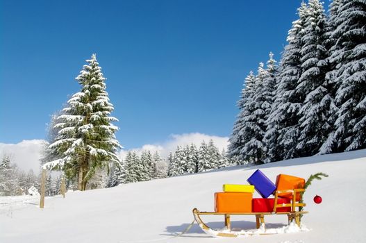 colorful presents on a Santa Claus sledge in a winter landscape