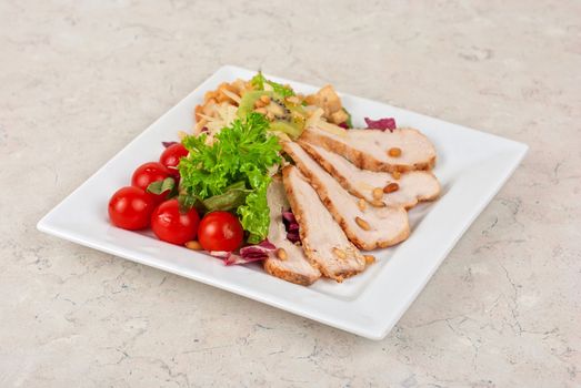 Tasty appetizer of meat, cherry tomato, greens and groundnut