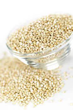 Quinoa grain in glass bowl on white background