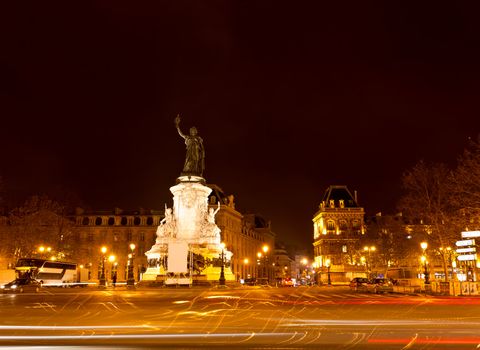 Marianne statue on the Republic square at night in Paris France