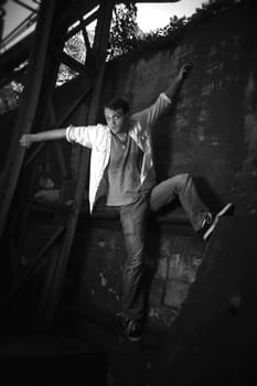 Man climbing wall in black and white