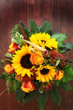 Bouquet of flowers of Sunflower and text freiraum on brown background
