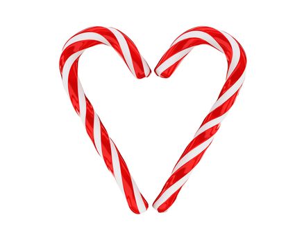 Heart made from christmas candies isolated on white background