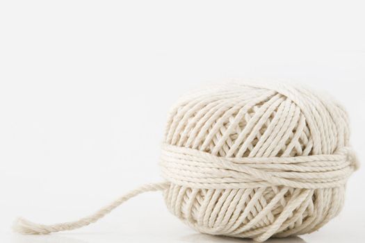closeup from white ball of twine, front view