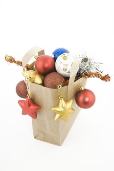 Christmas items in shopping  bag on white background