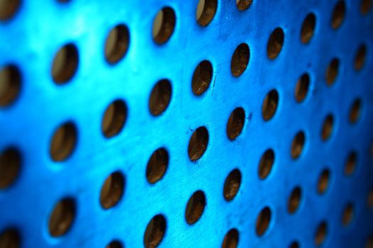 metal background with circles with blue toned