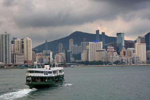 Ferry boat in Victoria Harbor, Hong Kong ,before storm comoing