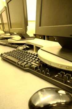 workplace room with computers in row close up
