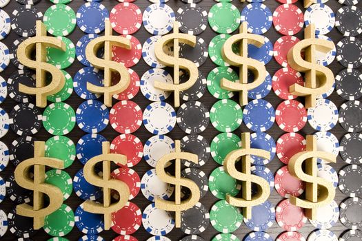 Close-up of gambling chips and US Dollar sign