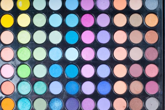 A make-up multi colored palette close up.