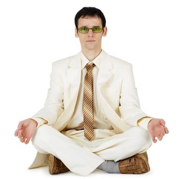 The young businessman in a light suit in an original way relaxes