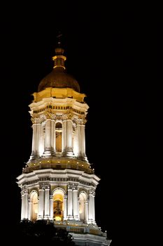 Tower of a church illuminated by night