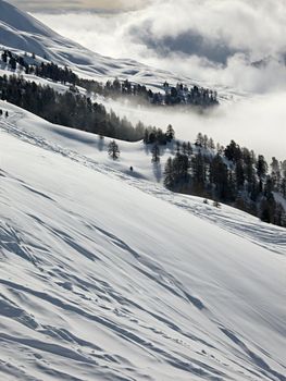 Mountain landscape with clouds and snow