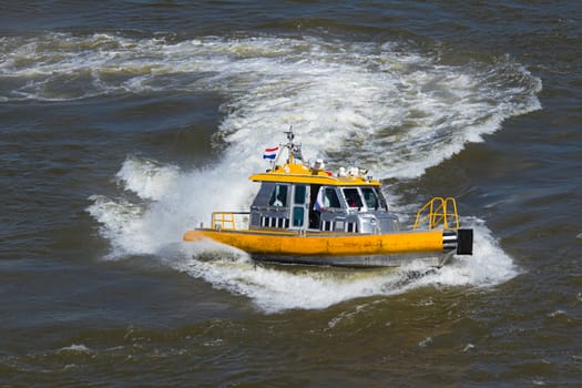 Yellow Crewtender passing by at high speed