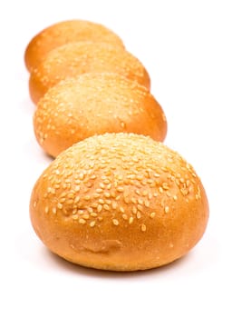 Row of buns with sesame isolated on the white background