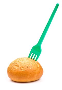 Fork in the bun with sesame isolated on the white background