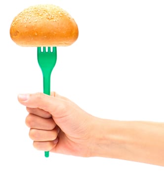 Hand holding a bun on the fork isolated on the white background