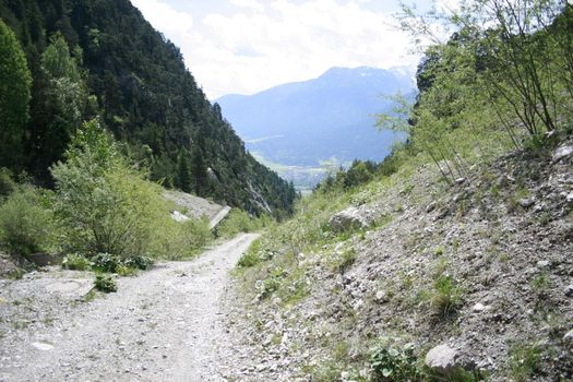 Village Oberhofen in Tyrol, in the front a stony walking way