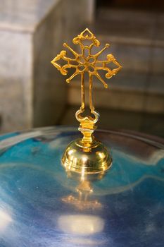 cross on a church font