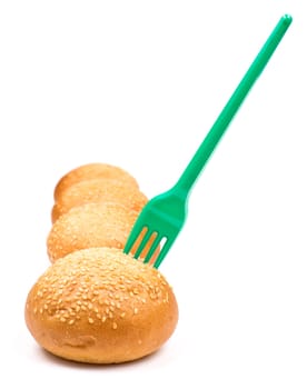 Row of buns and fork isolated on the white background