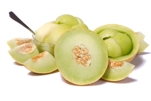 Close view of some sliced rock melon to serve as a fresh dessert isolated on a white background.