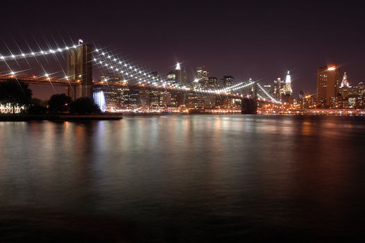 brooklyn bridge and manhattan in new york city, big white star lights