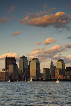 Buildings at the World Financial Center, dusk scene, Hudson river in foreground