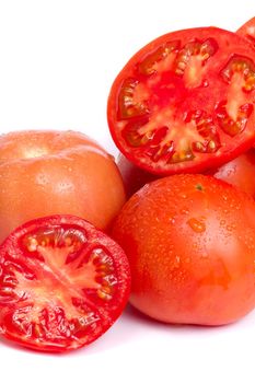 Close up view of some fresh red tomato isolated on a white background.