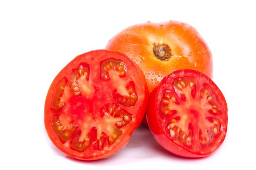 Close up view of some fresh red tomato isolated on a white background.