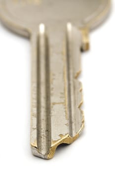 steel key detail on white background, distance blur