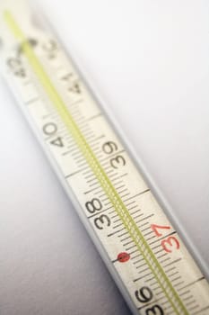 medical thermometer detail on light grey background