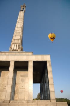 hot air balloons flying above slavin, bratislava landmark, monument for fallen soviet soldiers