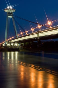 night photo of new bridge in bratislava, restaurant on top of the bridge