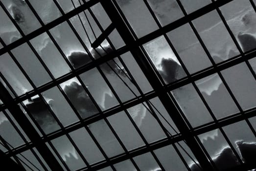 Snow covered glass roof shot from indoor 