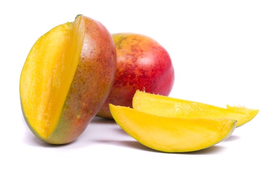 Close up view of two mango fruits isolated on a white background.
